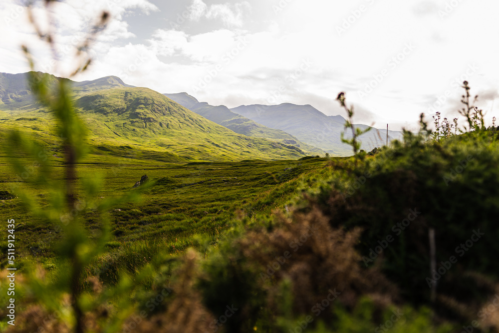Photo of the typical landscape of the Highlands in Scotland, the north part of the country is full of lakes and mountains Photo of the typical landscape of the Highlands in Scotland, the north part of the country is full of lakes and mountains