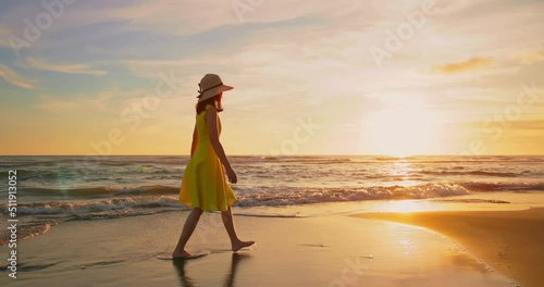 woman walking by beach