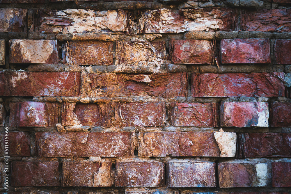 Stone wall with deep cracks. Break in the ground. Drought and consequences. Stone wall with deep cracks. Break in the ground. Drought and consequences.