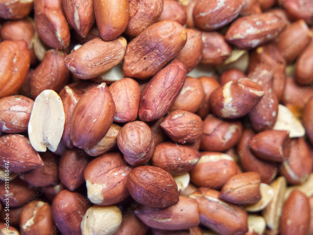 Roasted unpeeled peanuts macro, peanuts as a background Roasted unpeeled peanuts macro, peanuts as a background