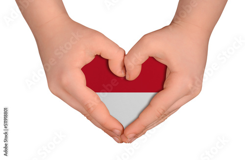 Kid s hands in heart- form. National peace concept on white background. Monaco