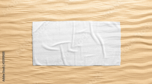 Blank white crumpled unfolded big towel mock up, sand background