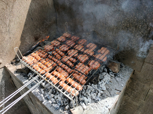 stuffed meat in a grill for cooking on a fire