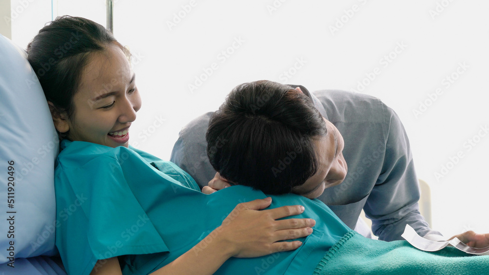 Fototapeta premium Husband listening sound flex in pregnant belly of wife. Man listening sound flex in pregnant woman.