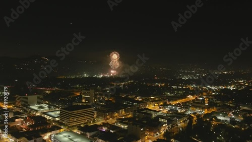 stunning aerial time lapse footage of a fireworks show at The Rose Bowl at night with cars driving on the streets below in Pasadena California USA photo