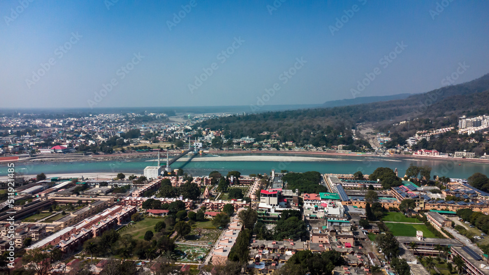 Fototapeta premium city building wide view situated at holy ganges riverbank at evening aerial