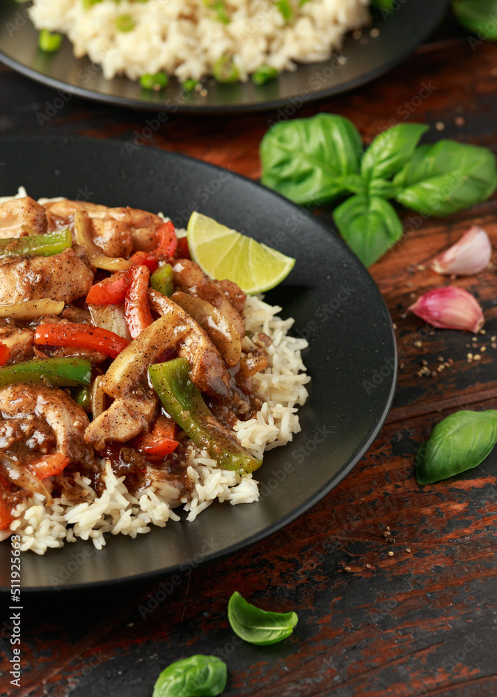 Stir fry pepper chicken with sweet peppers, onion, garlic and ginger Stir fry pepper chicken with sweet peppers, onion, garlic and ginger