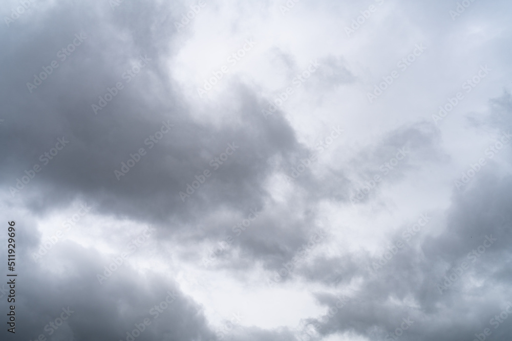 Sky with stormy gray cumulus clouds during rainy gloomy weather as background.