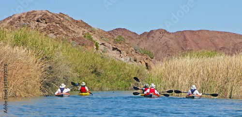 Canvastavla Six  kayakers are enjoying the waters of the Little Nile an inlet channel that