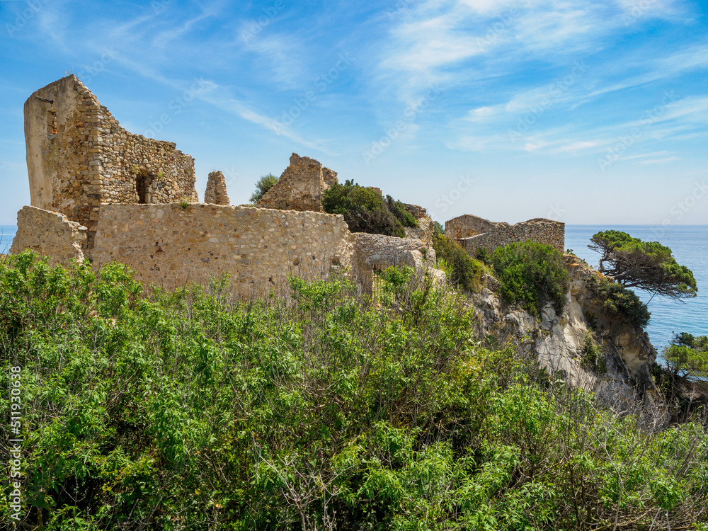Castle of Sant Esteve at sunny day. La Fosca beach, Catalonia, Spain.