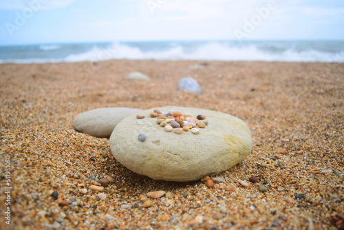 close up of beautiful pebbles in a quiet beach in a calm summer day © Joel Graca