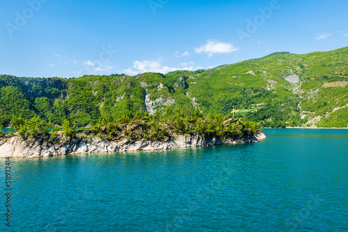 Komani Lake ferry cruise boat view near the town of Fierz, Albania. Komani Lake is a popular tourist destination in Albania. 