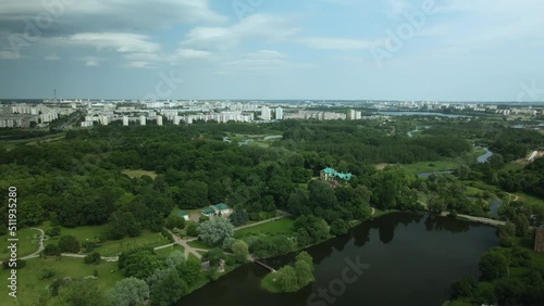 Flight over the city park. You can see park buildings. Aerial photography.. photo