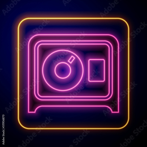Glowing neon Safe icon isolated on black background. The door safe a bank vault with a combination lock. Reliable Data Protection. Vector