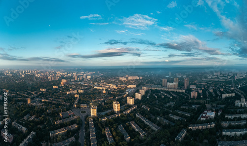 Sunny morning cityscape panorama in summer green city  residential district. Aerial cityscape above buildings and streets  Pavlovo Pole  Kharkiv Ukraine
