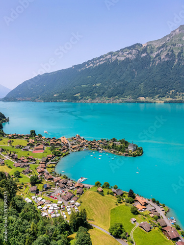 High view over the village of Iseltwald at the turquoise Brienz Lake in Switzerland.