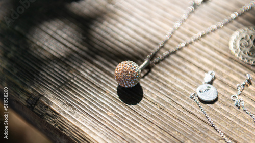 Jewellery lying on wooden background natural beauty