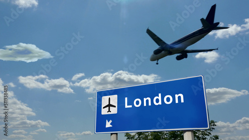 Plane landing in London England, UK airport with signboard photo
