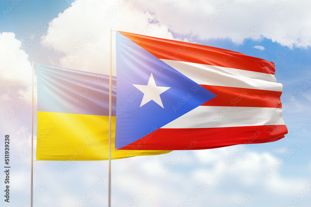 Sunny blue sky and flags of puerto rico and ukraine Sunny blue sky and flags of puerto rico and ukraine