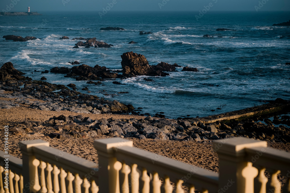 A view of the rocky ocean shore from the promenade.
