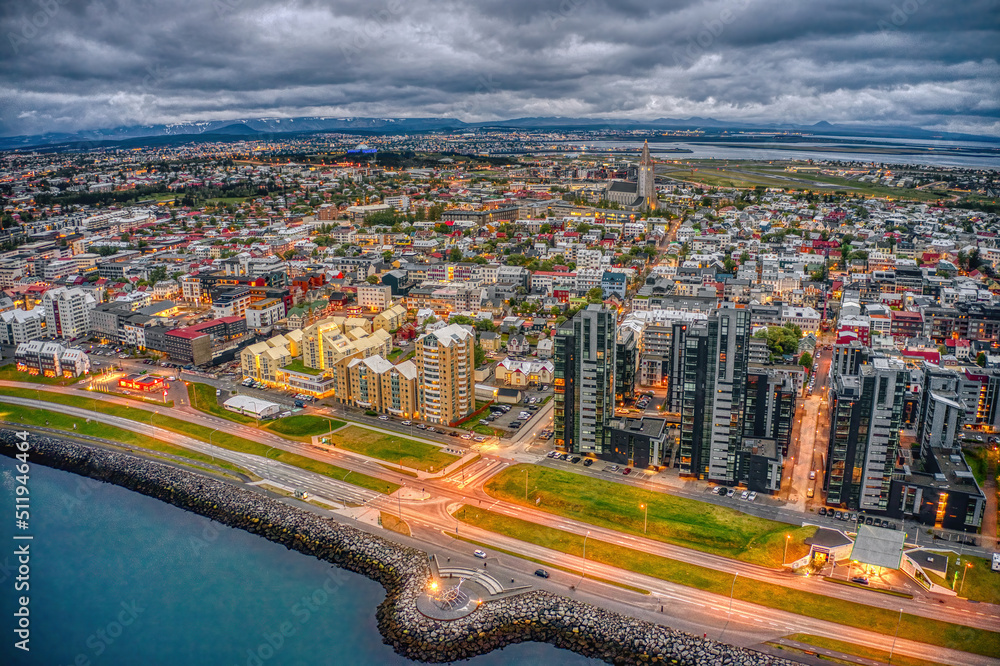Fototapeta premium Aerial View of the rapidly growing Urban Center of Reykjavik, Iceland at Night during Summer