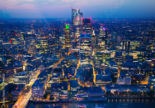 City of London at sunset. View include modern skyscrapers, London Bridge, banks and office buildings. © IRStone