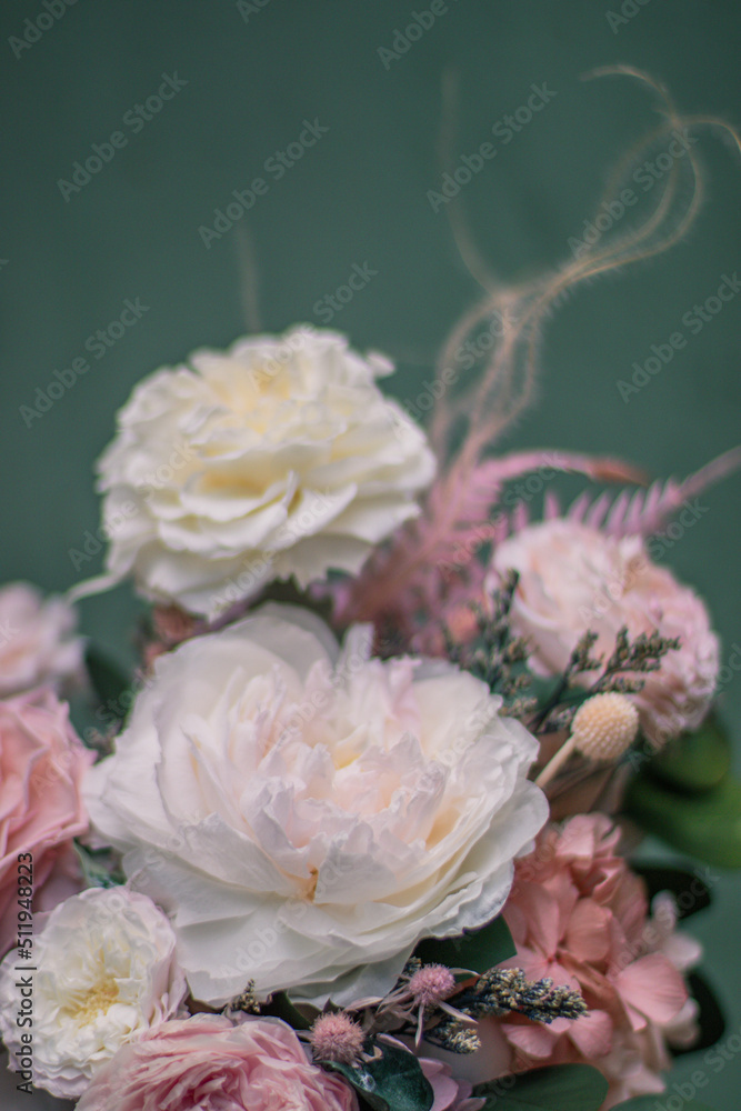 Beautiful spring flowers in box of tender peonies, roses. Preserved