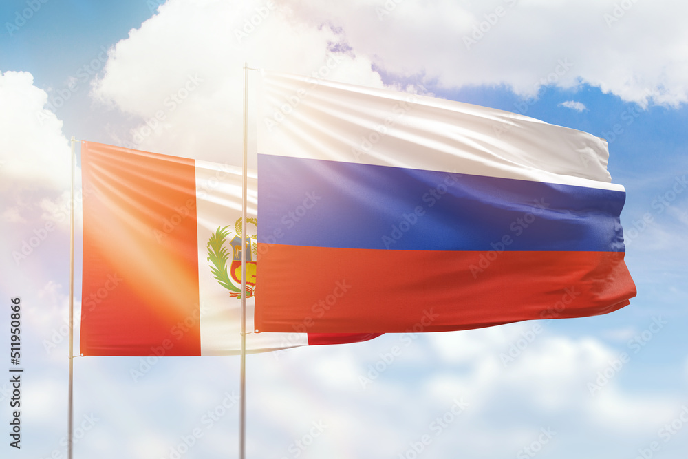 Sunny blue sky and flags of russia and peru Sunny blue sky and flags of russia and peru