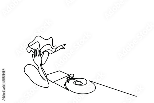 a female dj playing a song and keeping the rhythm having fun