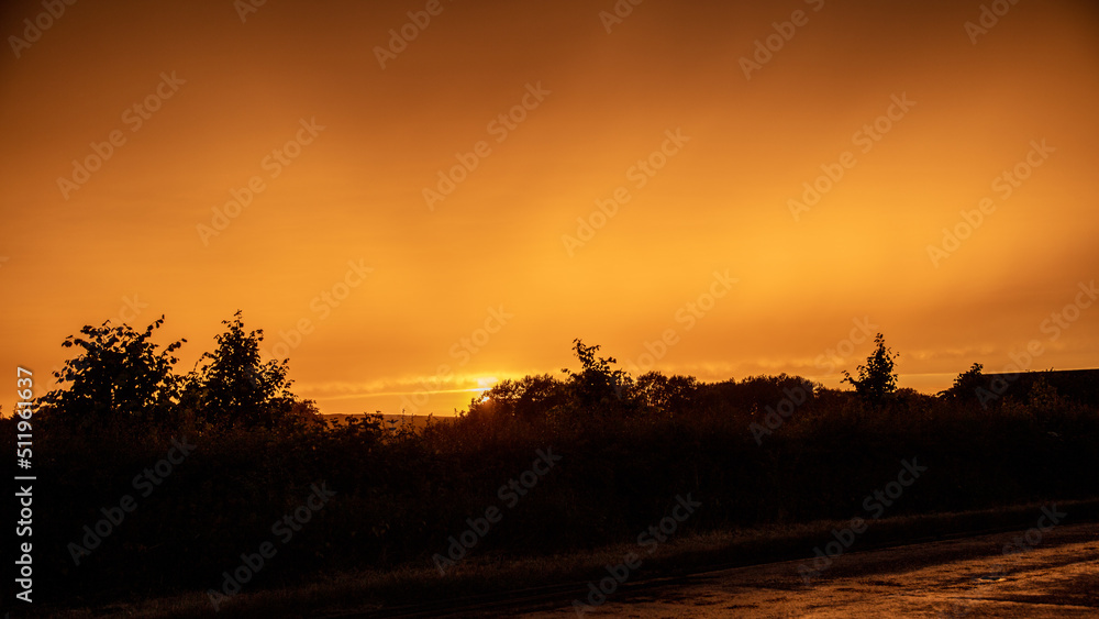 Sunset at Avebury in Wiltshire. Summer solstice.