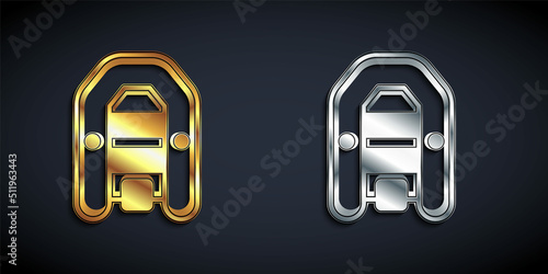 Gold and silver Inflatable boat with outboard motor icon isolated on black background. Long shadow style. Vector