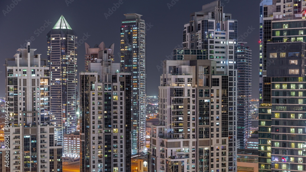 Bay Avenue with modern towers residential development in Business Bay aerial night timelapse, Dubai Bay Avenue with modern towers residential development in Business Bay aerial night timelapse, Dubai