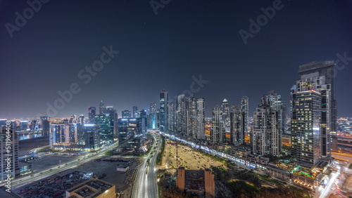 Bay Avenue with modern towers residential development in Business Bay aerial panoramic night timelapse, Dubai © neiezhmakov