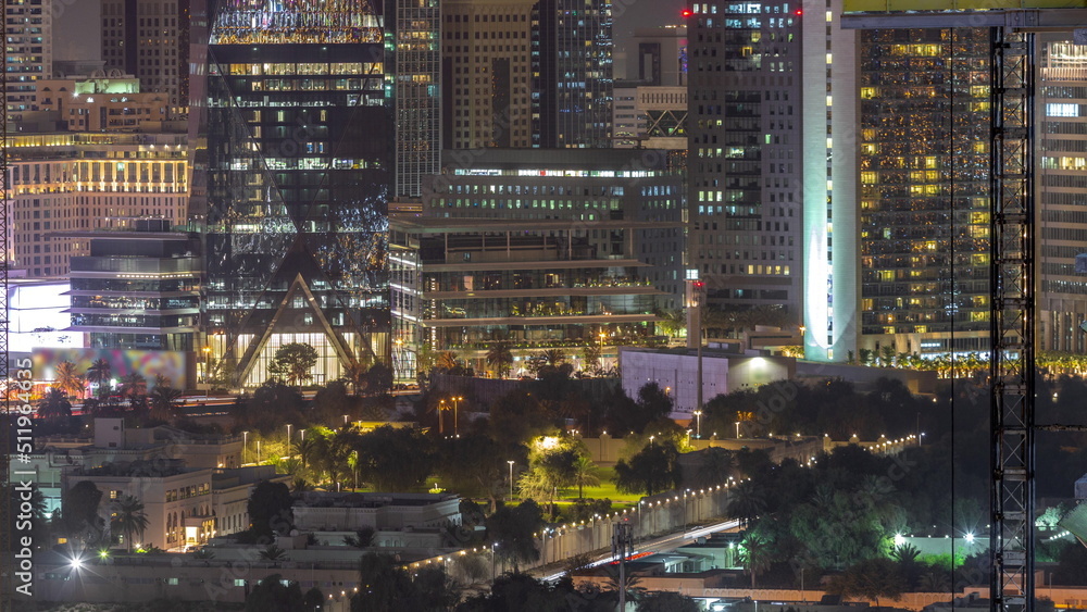 Obraz premium Modern buildings around Sheikh Zayed Road and DIFC district aerial night timelapse in Dubai