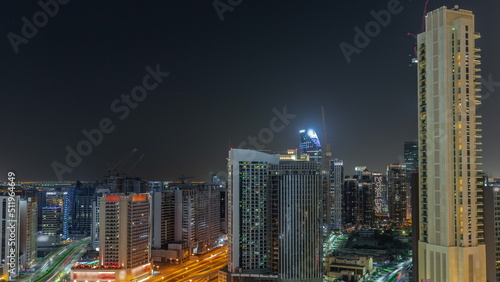 Skyscrapers at the Business Bay in Dubai aerial night timelapse  United Arab Emirates