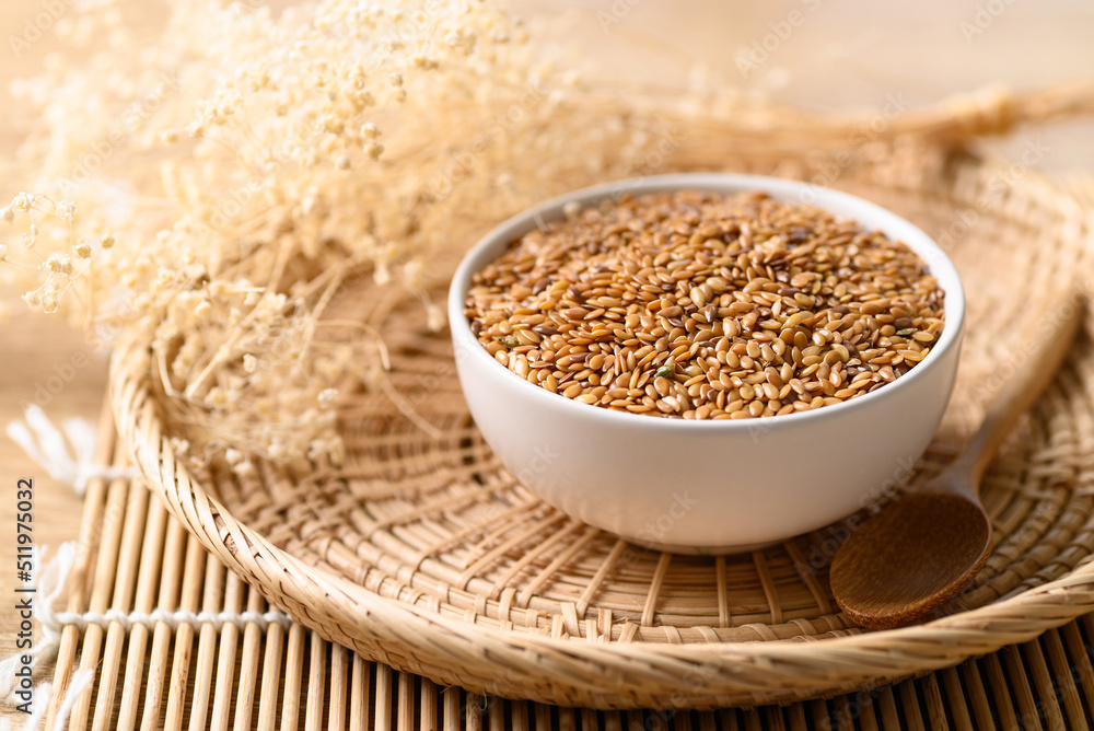 Golden flax seed or linseed in bowl Golden flax seed or linseed in bowl