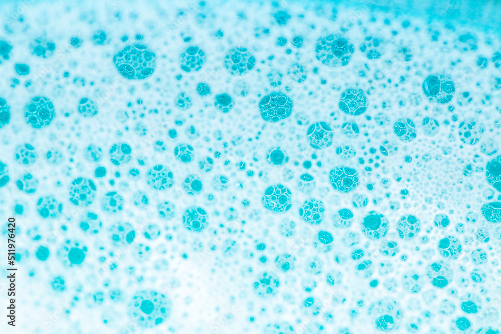  water with white foam bubbles.Cleanliness and hygiene background. Foam Water Soap Suds.Texture Foam Close-up. blue soap bubbles background.Laundry and cleaning background.foam bubbles.
