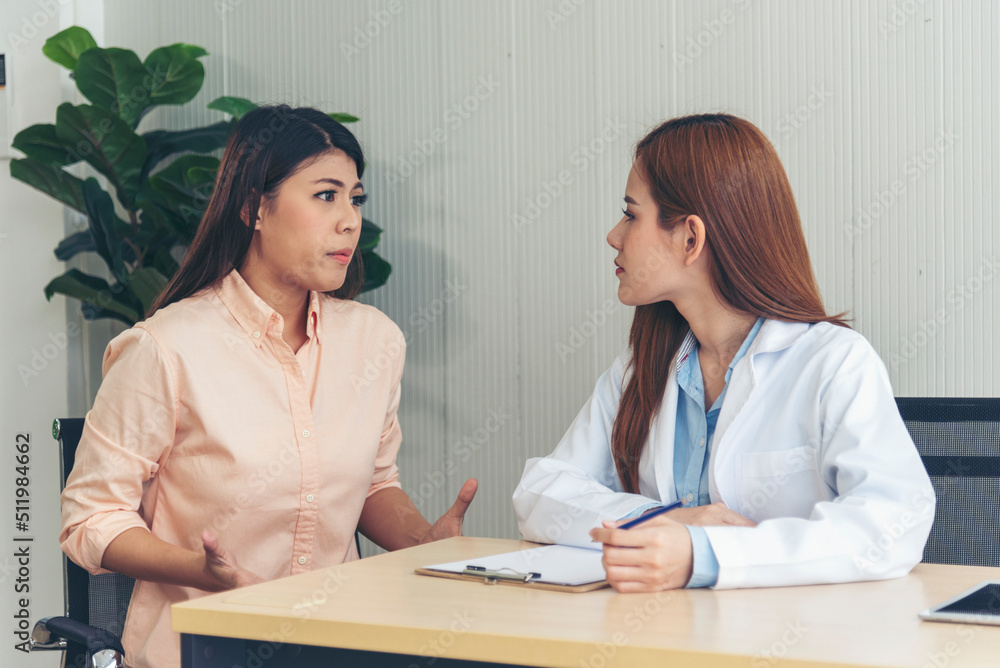 Woman doctor holding hands patient encourage cheer up consultation at hospital medicare treatment clinic. Doctor talking to patient support giving hope listening takecare for mental health therapy Woman doctor holding hands patient encourage cheer up consultation at hospital medicare treatment clinic. Doctor talking to patient support giving hope listening takecare for mental health therapy