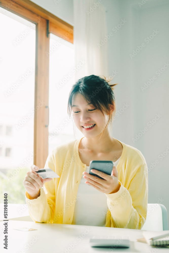 Woman hands holding credit card and using cell, smart phone. Woman hands holding credit card and using cell, smart phone.