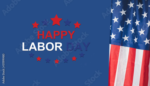 Happy Labor Day text and American Flag on a blue background