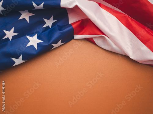 Close-up of the American flag on a brown background
