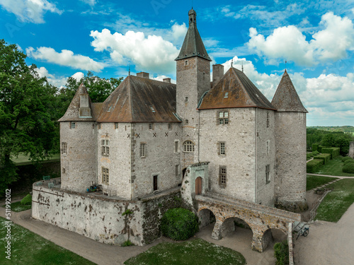 Aerial view of Beauvoir in Allier a medieval wonder that overlooks the valley of Besbre, with beautifully manicured French garden in idyllic setting with towers, bridge, moat, palace photo