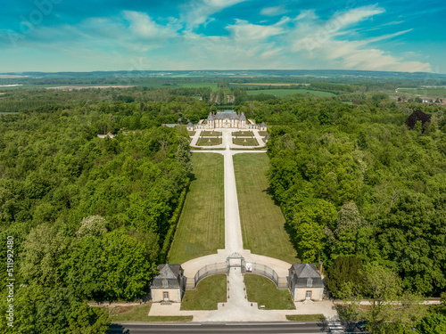 Aerial view of Motte Tilly castle, French baroque style stately home, manor house surrounded by a manicured garden in Champagne Ardenne France
