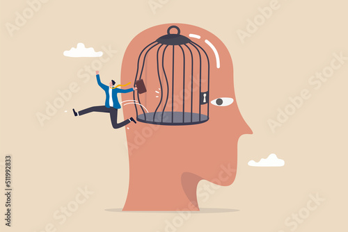 Freedom, break free from prison of thinking, inspiration or think out of the box, psychology or mental therapy, emotional concept, confidence businessman jump out of cage in his head for freedom.