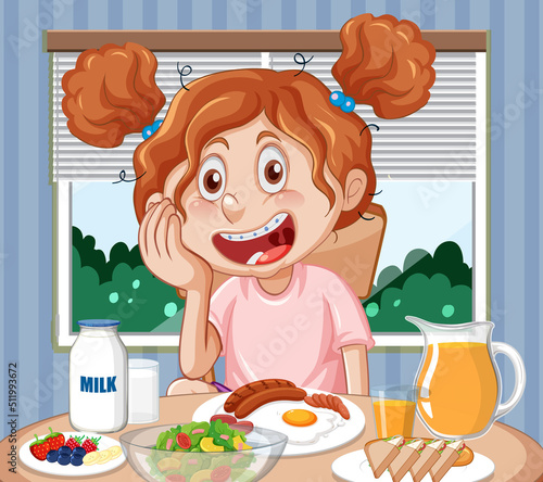 Happy girl eating breakfast at the table