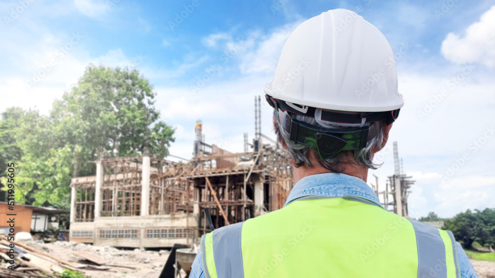 Behind the scenes of an engineer wearing a helmet at work. Portrait of an Asian engineer at a construction site Behind the scenes of an engineer wearing a helmet at work. Portrait of an Asian engineer at a construction site