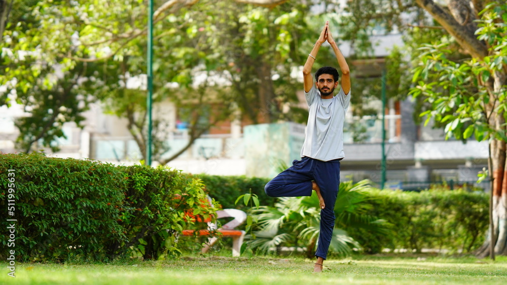 man practicing yoga in India