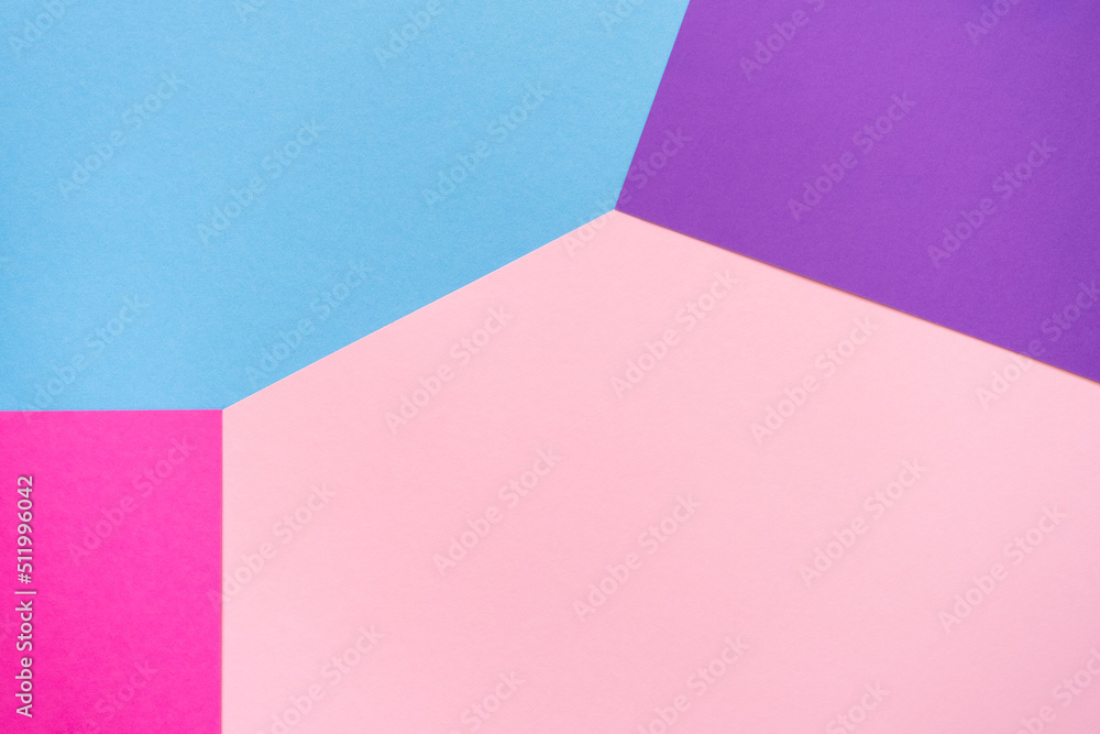 Pink, purple, violet and light blue paper background. Geometric figures, shapes, lines. Multicolor abstract flat lay composition. Copy space, top view.