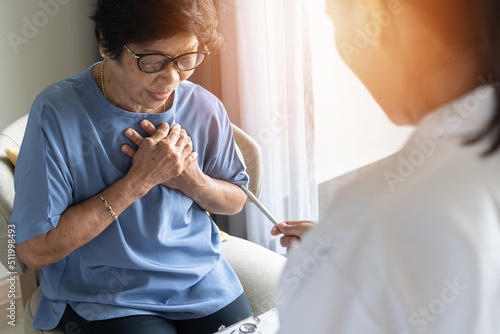 Foto Elderly patient, senior old aging woman with coronary artery disease or heart il