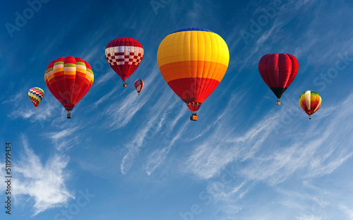 Colorful hot air balloon fly over the blue sky, Panorama blue sky and clouds, Hot air balloon over blue sky and white clouds